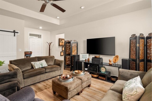 805 Willow Creek Cir, San Marcos, TX 78666 - living room featuring wood finished floors, a barn door, ceiling fan, and recessed lighting