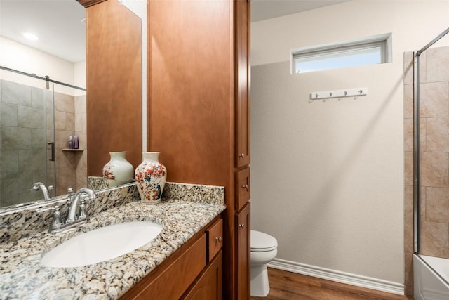 805 Willow Creek Cir, San Marcos, TX 78666 - bathroom with wood finished floors, toilet, baseboards, and vanity