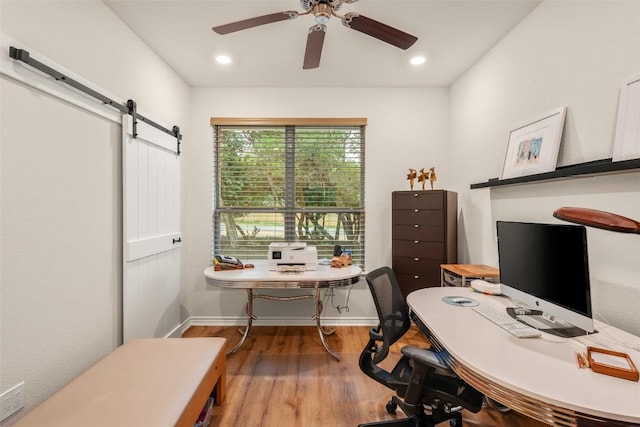 805 Willow Creek Cir, San Marcos, TX 78666 - home office featuring wood finished floors, a ceiling fan, a barn door, recessed lighting, and baseboards