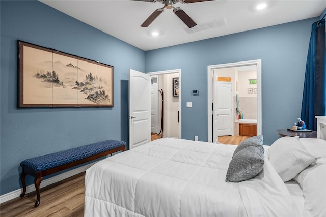 805 Willow Creek Cir, San Marcos, TX 78666 - bedroom with light wood-type flooring, a ceiling fan, baseboards, recessed lighting, and connected bathroom