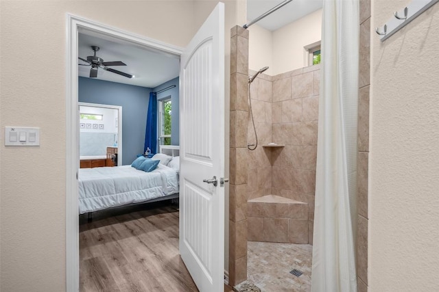 805 Willow Creek Cir, San Marcos, TX 78666 - ensuite bathroom featuring tiled shower, wood finished floors, and a ceiling fan