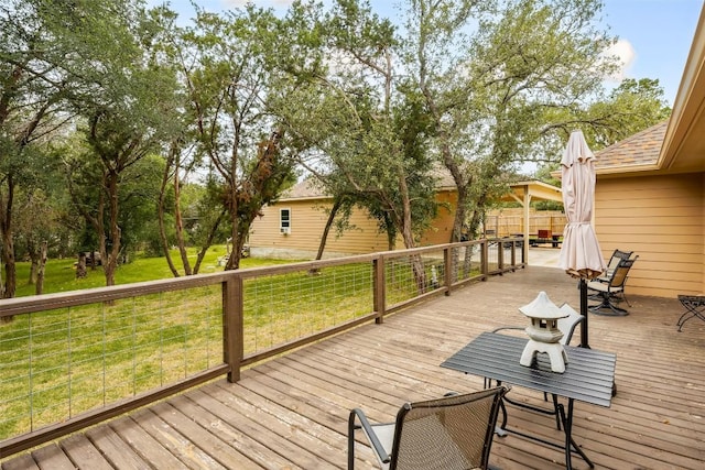 805 Willow Creek Cir, San Marcos, TX 78666 - wooden deck featuring a lawn and outdoor dining area
