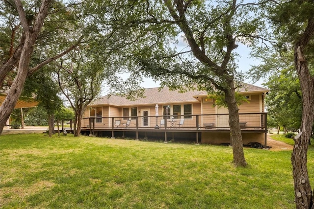 805 Willow Creek Cir, San Marcos, TX 78666 - back of house featuring a lawn, a wooden deck, and roof with shingles