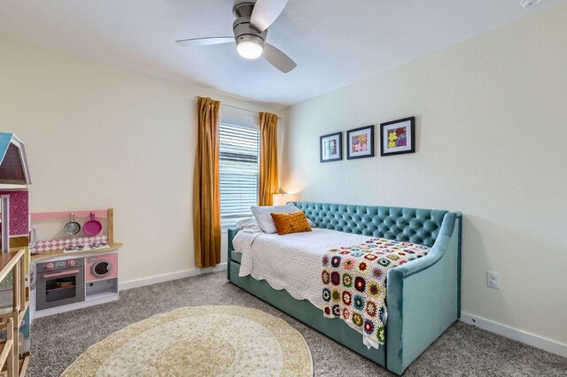 13908 Neskar Dr, Pflugerville, TX 78660 - carpeted bedroom with ceiling fan and baseboards