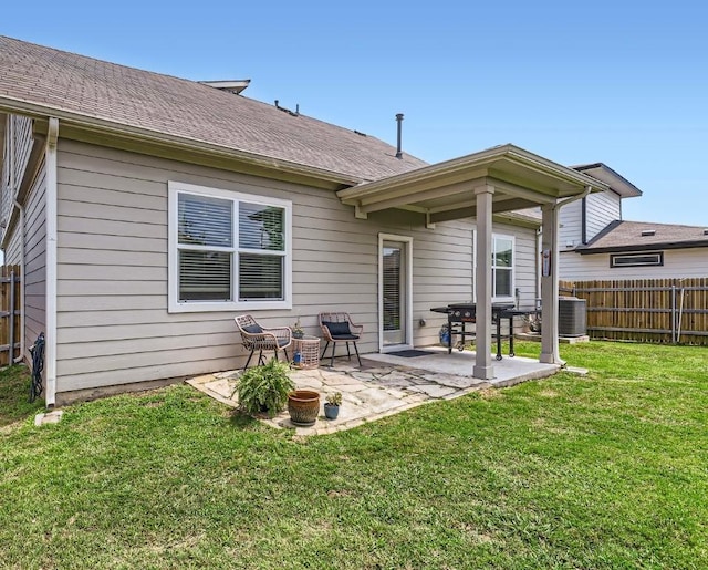 13908 Neskar Dr, Pflugerville, TX 78660 - back of house with a patio area, cooling unit, and a shingled roof
