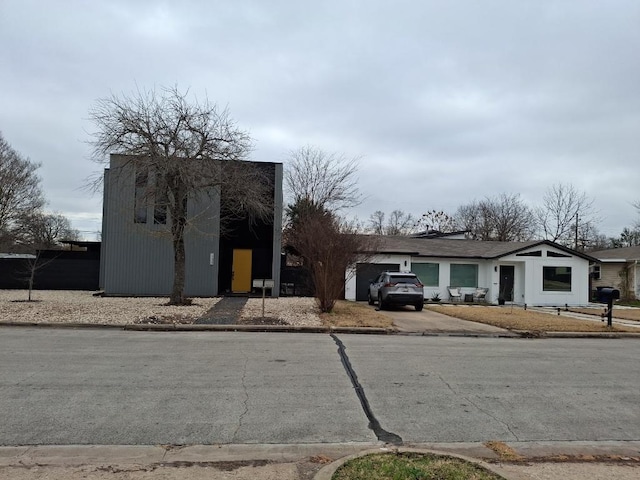 7520 Delafield Ln, Austin, TX 78752 - view of front of property with concrete driveway and a garage