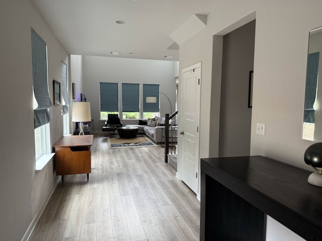 2404 Pack Iron Pass, Leander, TX 78641 - hall featuring light wood-style flooring, plenty of natural light, and baseboards