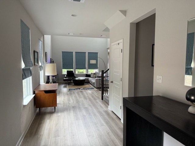 2404 Pack Iron Pass, Leander, TX 78641 - living area featuring healthy amount of natural light, light wood finished floors, and baseboards