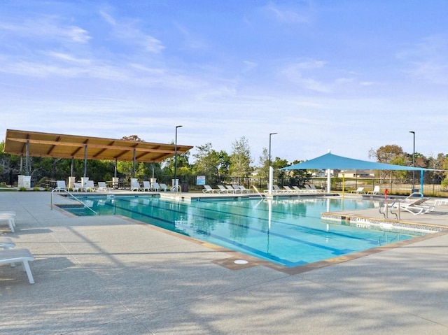 2404 Pack Iron Pass, Leander, TX 78641 - community pool with a patio and fence
