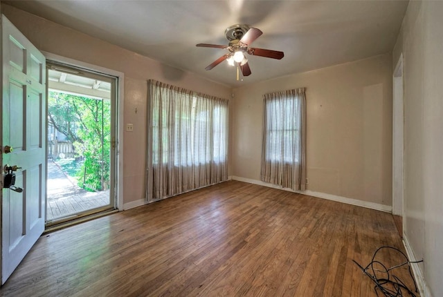 214 Beaver St, Austin, TX 78753 - spare room with wood finished floors, baseboards, and healthy amount of natural light