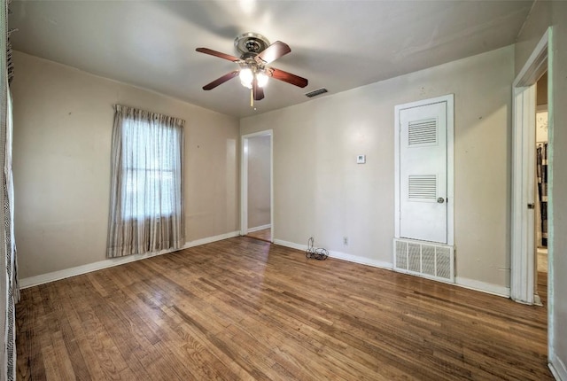 214 Beaver St, Austin, TX 78753 - spare room featuring a ceiling fan, wood finished floors, and baseboards