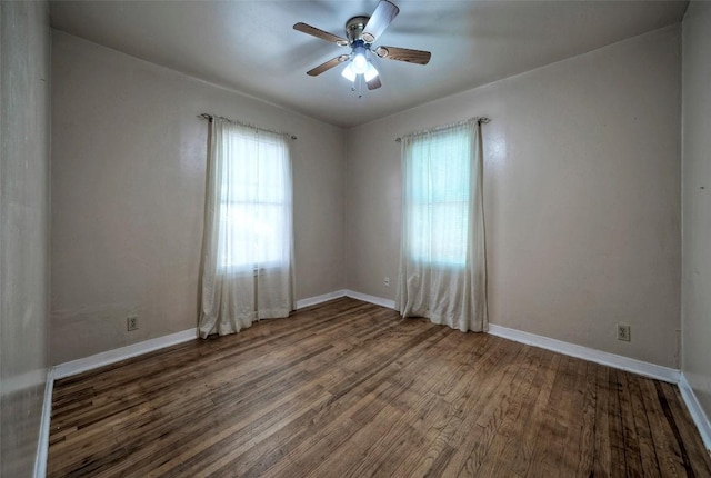 214 Beaver St, Austin, TX 78753 - unfurnished room with wood finished floors, a ceiling fan, and baseboards