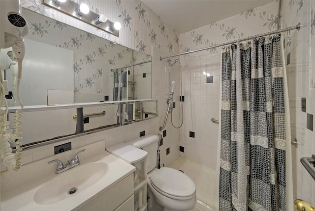 214 Beaver St, Austin, TX 78753 - full bathroom featuring wallpapered walls, a stall shower, toilet, and vanity
