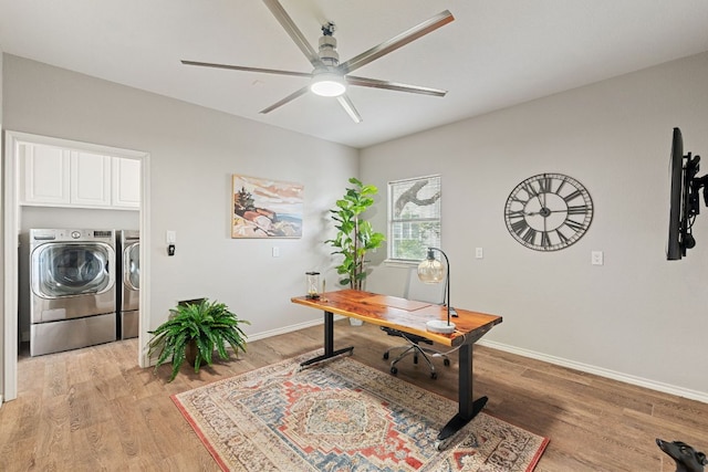 212 Lakefront Dr, Point Venture, TX 78645 - home office with washing machine and dryer, ceiling fan, baseboards, and light wood-type flooring