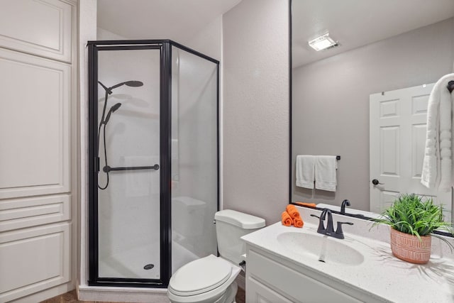 212 Lakefront Dr, Point Venture, TX 78645 - full bathroom featuring a shower stall, vanity, and toilet