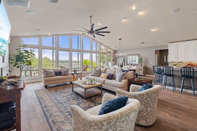 212 Lakefront Dr, Point Venture, TX 78645 - living room featuring a ceiling fan, wood finished floors, and high vaulted ceiling