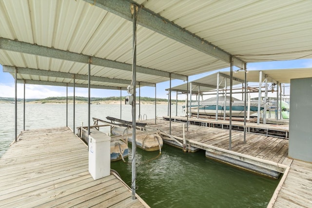 212 Lakefront Dr, Point Venture, TX 78645 - dock with boat lift and a water view