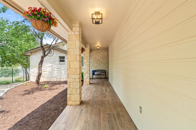 212 Lakefront Dr, Point Venture, TX 78645 - view of exterior entry with stone siding and fence
