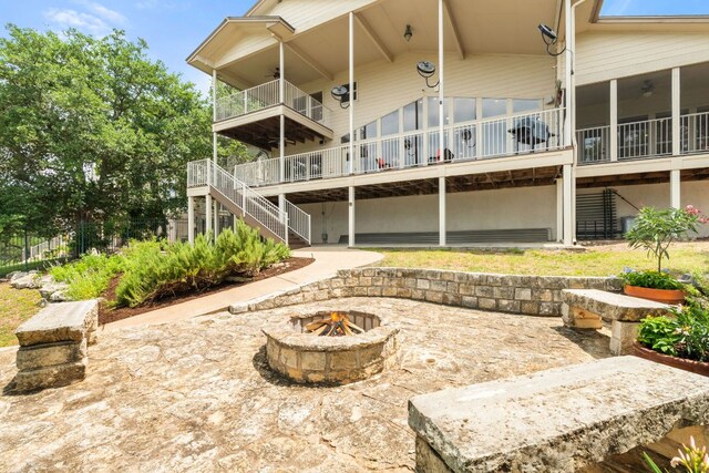 212 Lakefront Dr, Point Venture, TX 78645 - rear view of property featuring stairs, a fire pit, a ceiling fan, a patio, and a deck