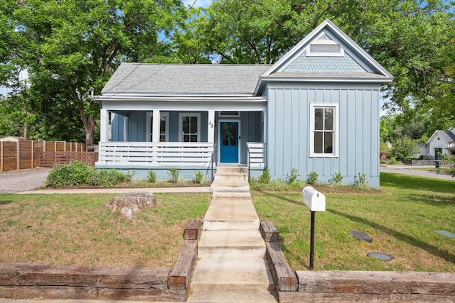 48 Chicon St, Austin, TX 78702 - view of front of home featuring board and batten siding, covered porch, and roof with shingles