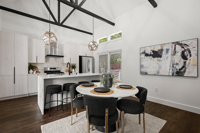 48 Chicon St, Austin, TX 78702 - dining room with a towering ceiling, baseboards, and dark wood-style flooring