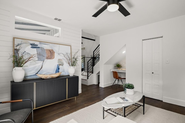 48 Chicon St, Austin, TX 78702 - living room featuring stairs, wood finished floors, ceiling fan, and baseboards