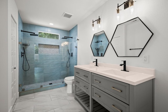 48 Chicon St, Austin, TX 78702 - bathroom with double vanity, a walk in shower, and marble look tile flooring