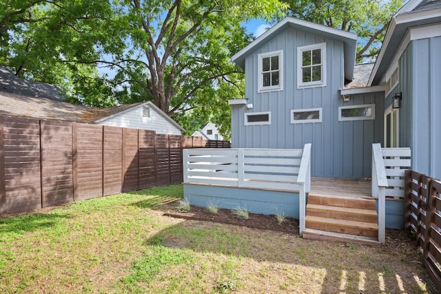 48 Chicon St, Austin, TX 78702 - back of property featuring board and batten siding, a fenced backyard, and a deck