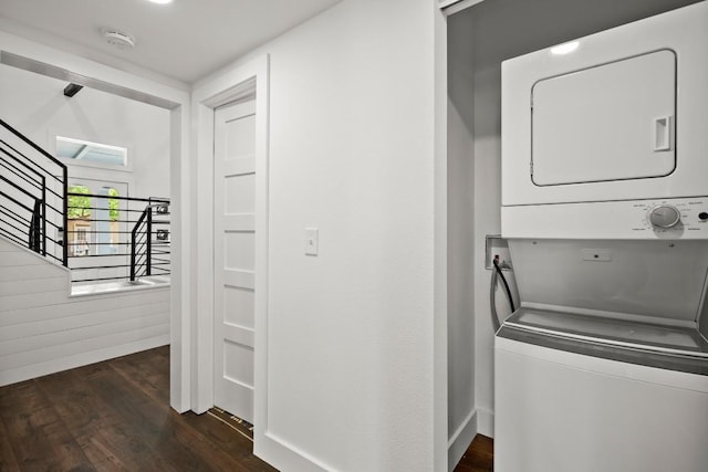 48 Chicon St, Austin, TX 78702 - laundry room with stacked washer and clothes dryer and dark wood-style flooring