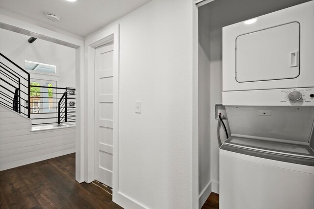 48 Chicon St, Austin, TX 78702 - laundry area featuring stacked washing machine and dryer and dark wood-style floors