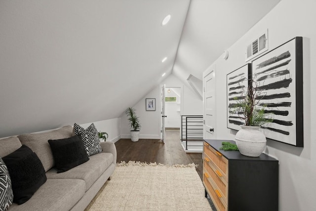 48 Chicon St, Austin, TX 78702 - living area with lofted ceiling, wood finished floors, and baseboards