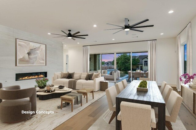 98 Wennmohs Pl, Horseshoe Bay, TX 78657 - dining space with wood finished floors, recessed lighting, a tiled fireplace, and a ceiling fan