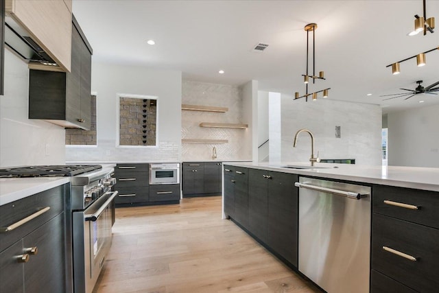98 Wennmohs Pl, Horseshoe Bay, TX 78657 - kitchen with appliances with stainless steel finishes, a sink, backsplash, light countertops, and recessed lighting