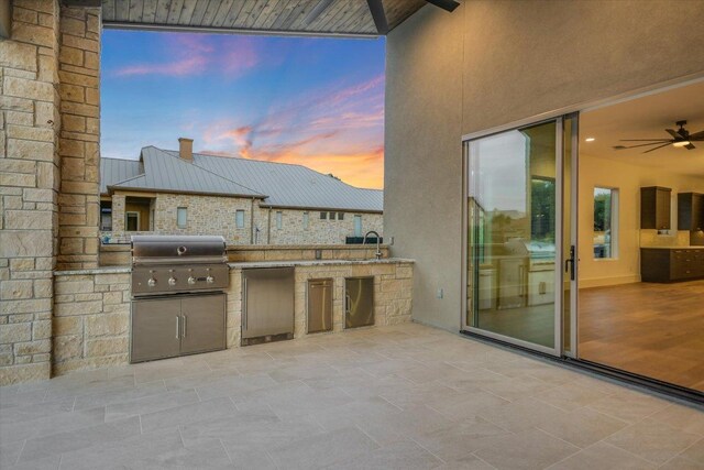 98 Wennmohs Pl, Horseshoe Bay, TX 78657 - patio terrace at dusk with grilling area, area for grilling, and a ceiling fan
