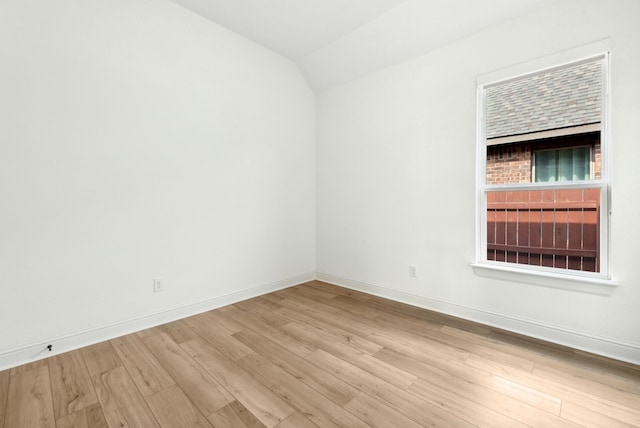 300 Barrel Bnd, Georgetown, TX 78628 - spare room featuring wood finished floors and lofted ceiling