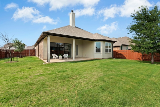 300 Barrel Bnd, Georgetown, TX 78628 - rear view of property featuring a patio area, a fenced backyard, a chimney, and roof with shingles