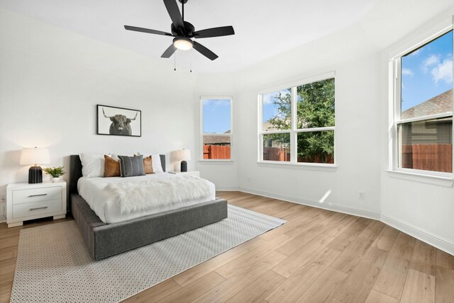300 Barrel Bnd, Georgetown, TX 78628 - bedroom with light wood-style floors and ceiling fan