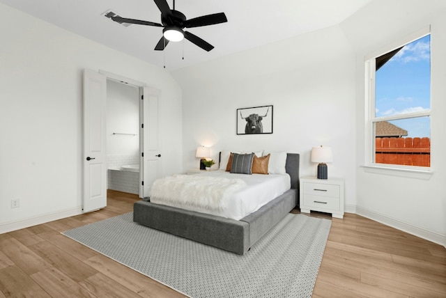 300 Barrel Bnd, Georgetown, TX 78628 - bedroom featuring light wood-style floors, ensuite bath, and ceiling fan