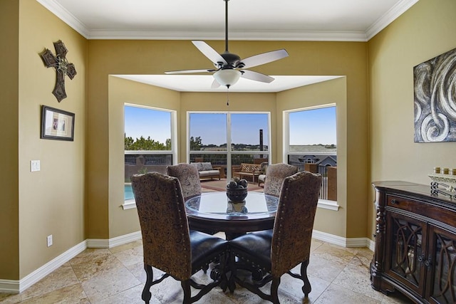 3211 Constitution Dr, Lago Vista, TX 78645 - dining area featuring ornamental molding, a ceiling fan, and stone tile floors