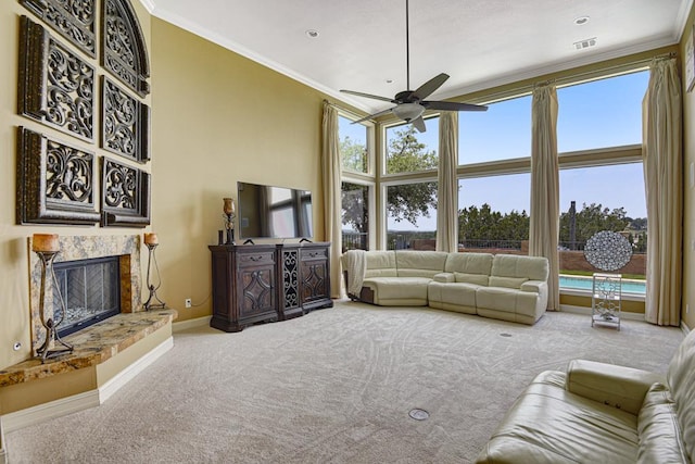 3211 Constitution Dr, Lago Vista, TX 78645 - living room featuring carpet, ornamental molding, a ceiling fan, and a premium fireplace