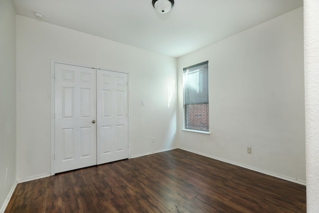 1244 Yellow Iris Rd, Leander, TX 78641 - unfurnished bedroom featuring dark wood-type flooring and a closet