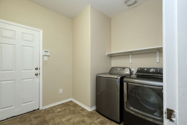 1244 Yellow Iris Rd, Leander, TX 78641 - laundry area featuring washer and dryer and baseboards