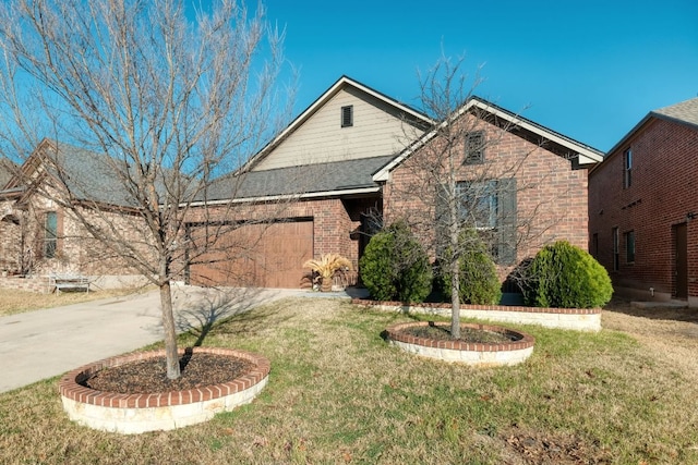 1244 Yellow Iris Rd, Leander, TX 78641 - view of front of house featuring driveway, an attached garage, a front yard, and brick siding