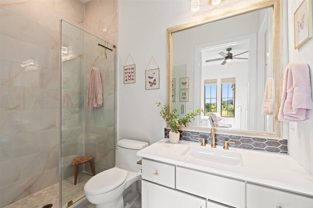 6901 Davenport Divide Rd, Austin, TX 78738 - full bathroom with a stall shower, toilet, vanity, and ceiling fan