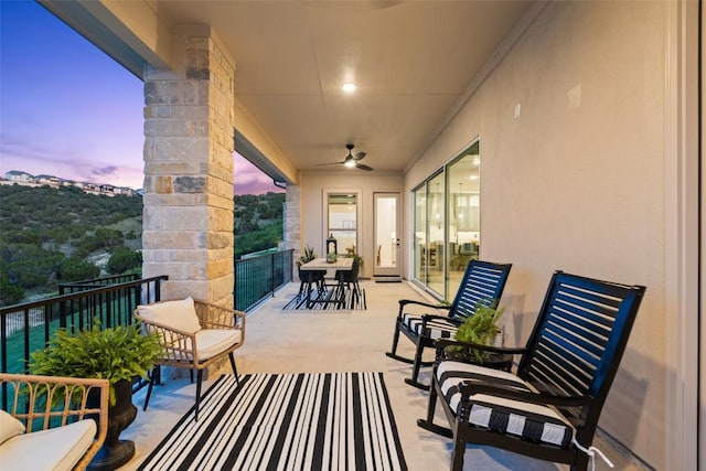 6901 Davenport Divide Rd, Austin, TX 78738 - patio terrace at dusk featuring a balcony and a ceiling fan