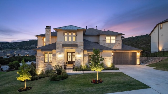 6901 Davenport Divide Rd, Austin, TX 78738 - view of front of house featuring stone siding, concrete driveway, a garage, and stucco siding