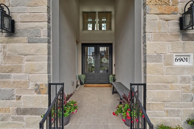 6901 Davenport Divide Rd, Austin, TX 78738 - property entrance with french doors and stucco siding