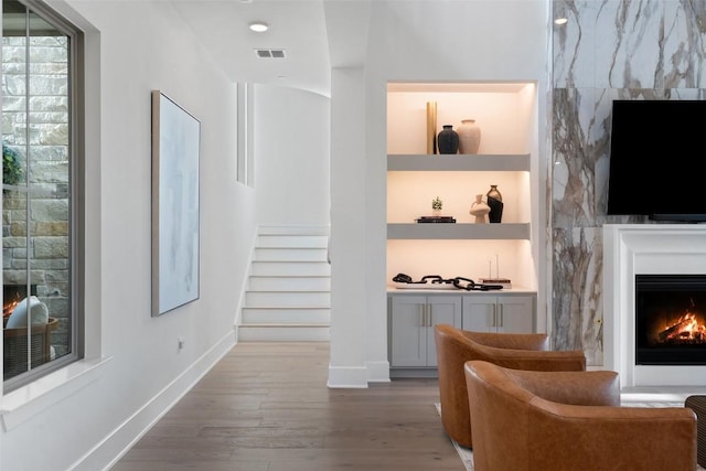 6901 Davenport Divide Rd, Austin, TX 78738 - corridor with wood finished floors, stairway, built in features, and baseboards