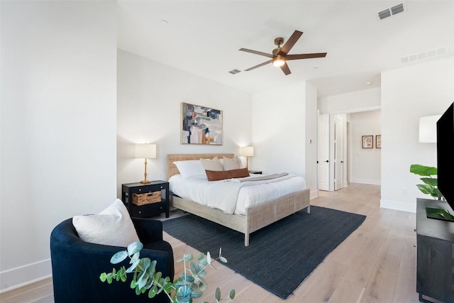 6901 Davenport Divide Rd, Austin, TX 78738 - bedroom featuring light wood-style floors, baseboards, and a ceiling fan
