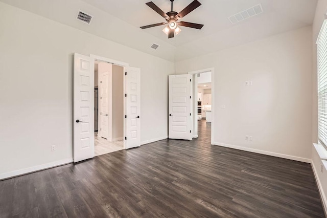 461 Constitution Way, Kyle, TX 78640 - unfurnished bedroom with dark wood finished floors, baseboards, and high vaulted ceiling